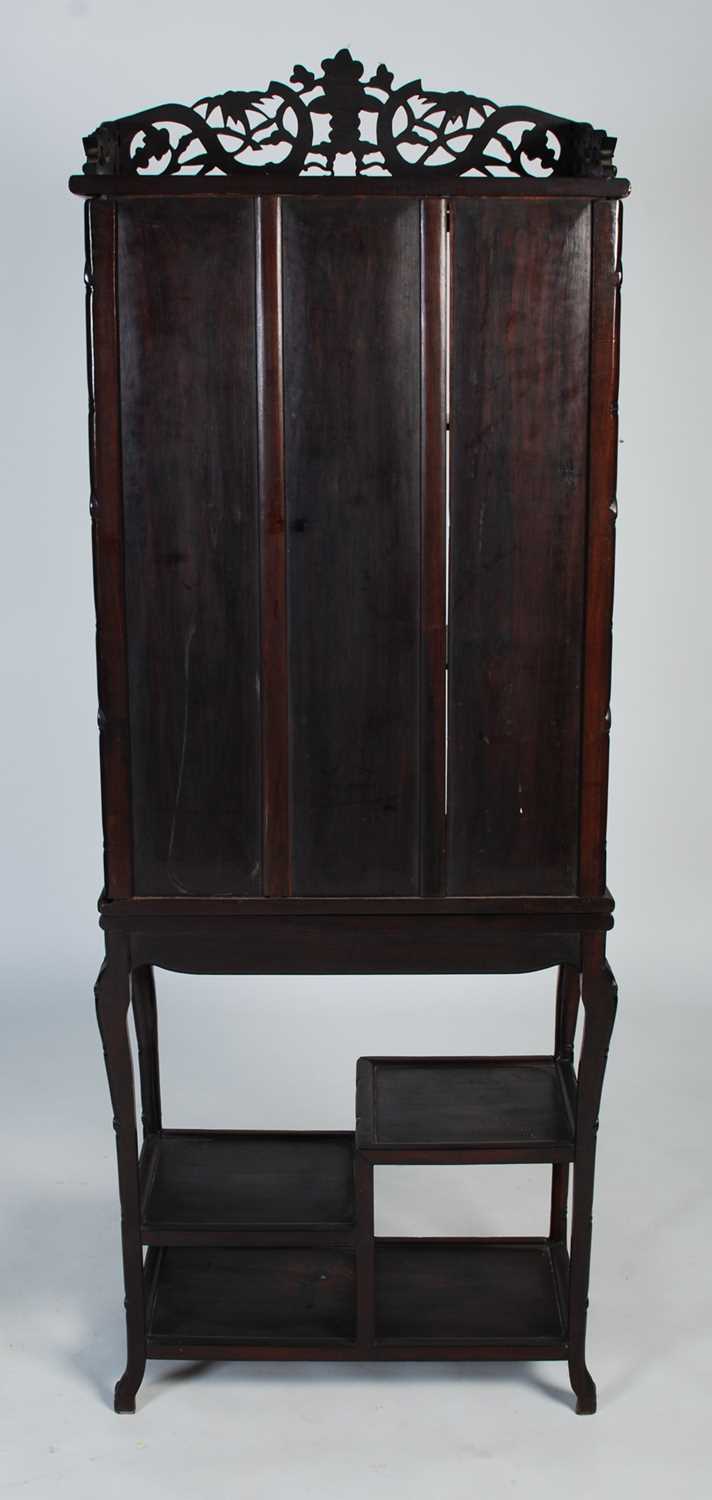 A Chinese dark wood display cabinet, late 19th/ early 20th century, the upper section with bamboo, - Image 6 of 6