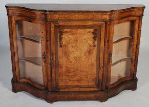 A 19th century walnut, marquetry and gilt metal mounted credenza, the shaped top above a plain