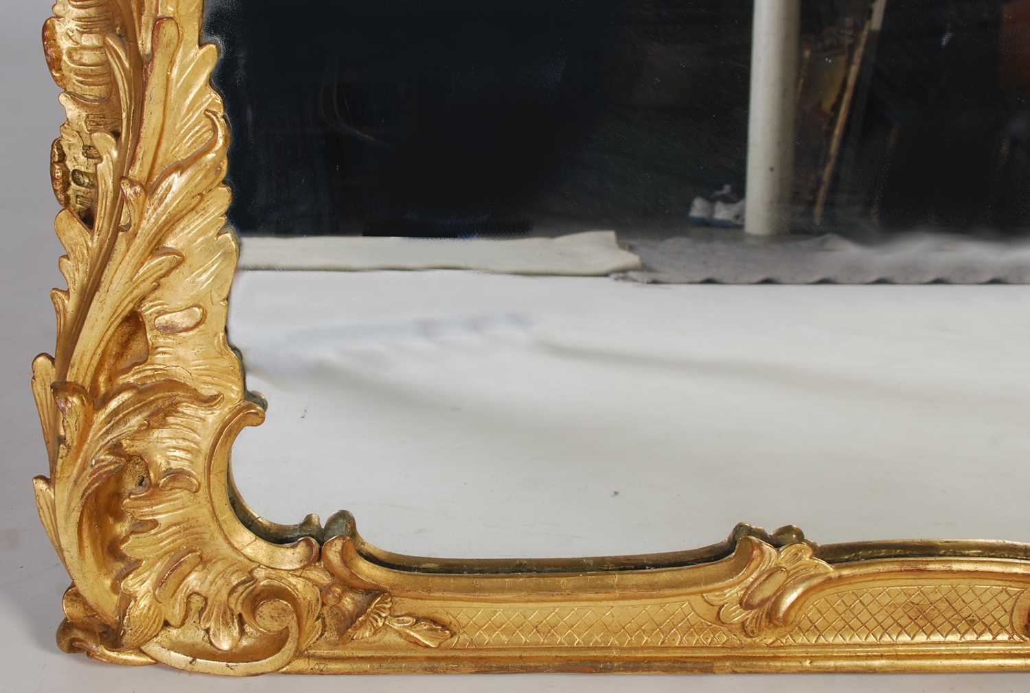 A 19th century carved giltwood over mantel mirror, the frame carved with scrolls, flowers and - Image 4 of 5