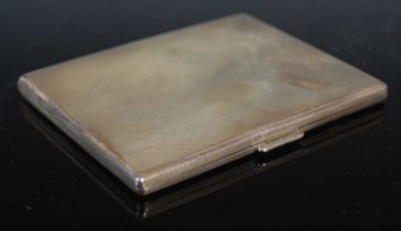 A George VI silver cigarette case, Birmingham 1940, makers mark of D&F, with engine turned