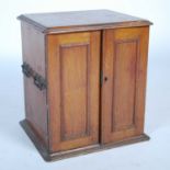 A 19th century oak tabletop specimen cabinet, the rounded rectangular top with a moulded edge over a