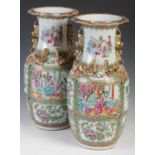 A pair of Chinese porcelain famille rose canton vases, Qing Dynasty, decorated with rectangular