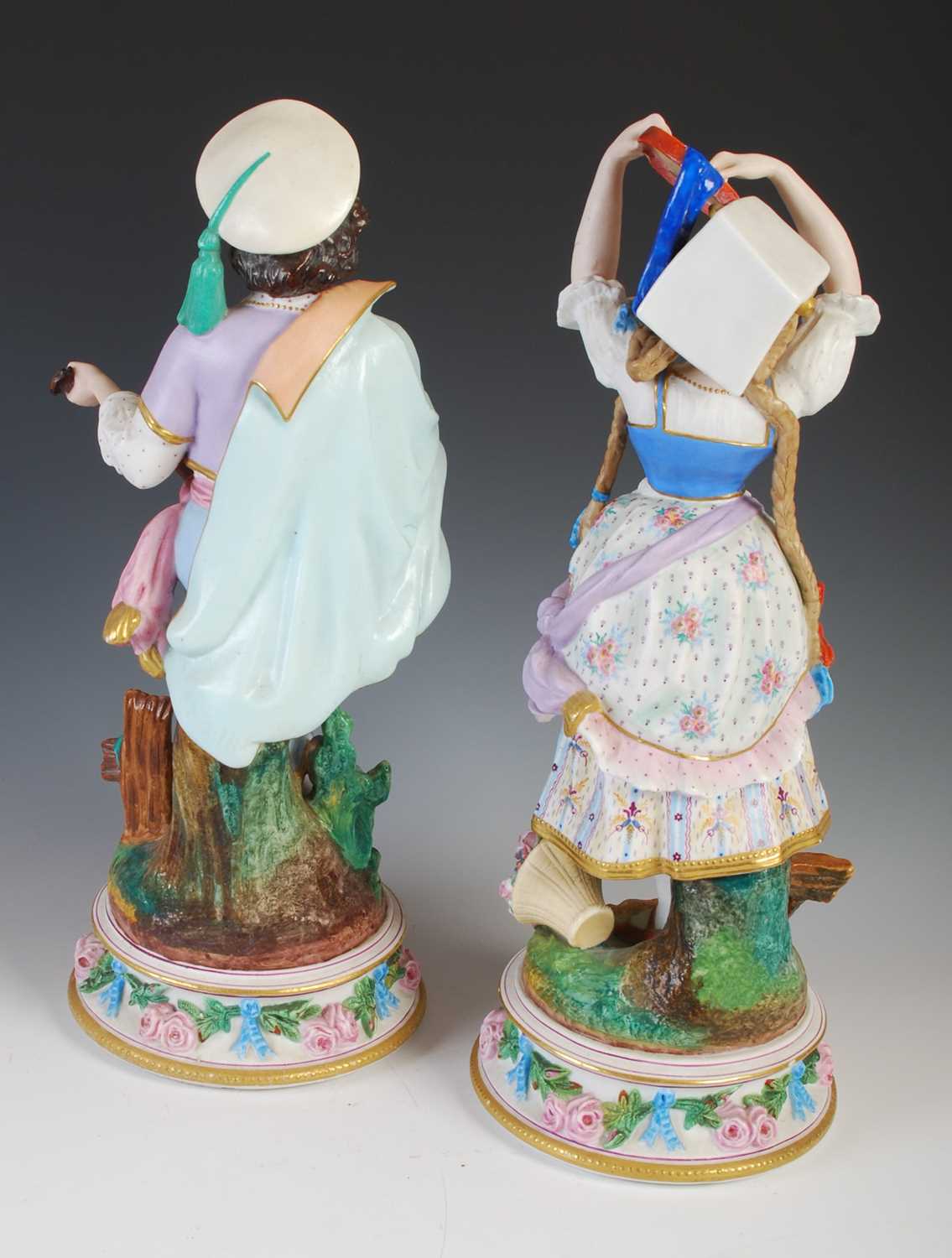 A pair of late 19th century French Bisque porcelain figures, modelled as a boy playing the - Image 6 of 9