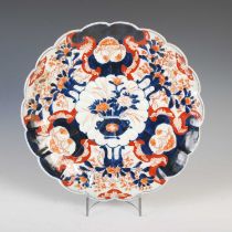 A Japanese Imari porcelain charger, late 19th / early 20th century, centred with a shaped circular