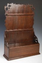 A George III oak spoon rack, the fret-cut upright back with two horizontal spoon receptacles above a