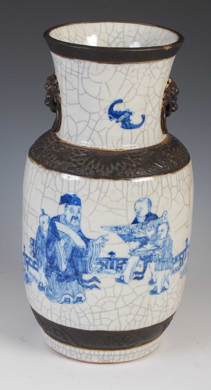 A Chinese porcelain blue and white crackle glazed vase, Qing Dynasty, decorated with scholar and