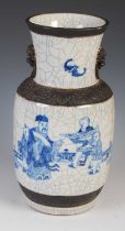 A Chinese porcelain blue and white crackle glazed vase, Qing Dynasty, decorated with scholar and