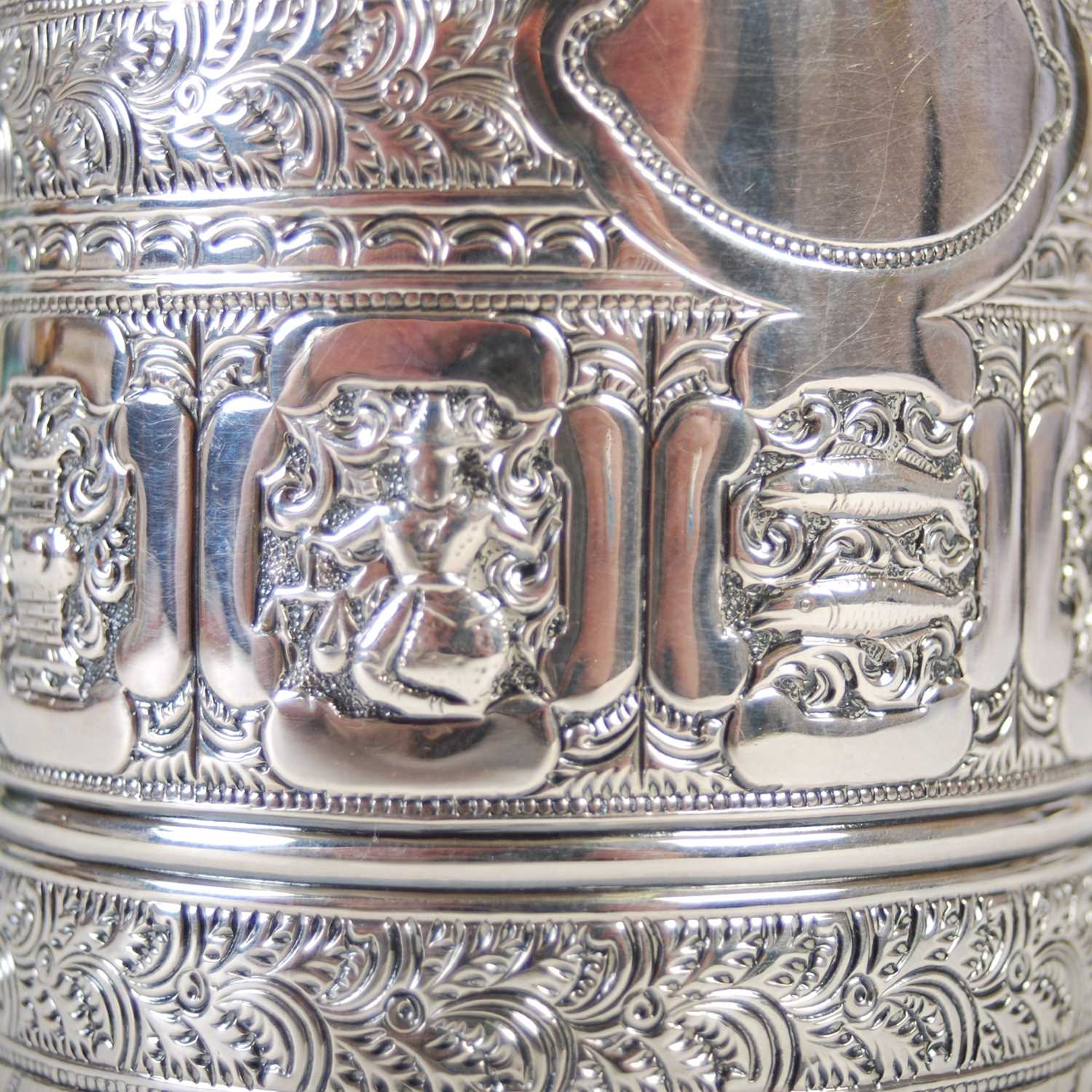 A Victorian Scottish silver christening mug, in the Indian taste, richly embossed with a band of - Image 3 of 6