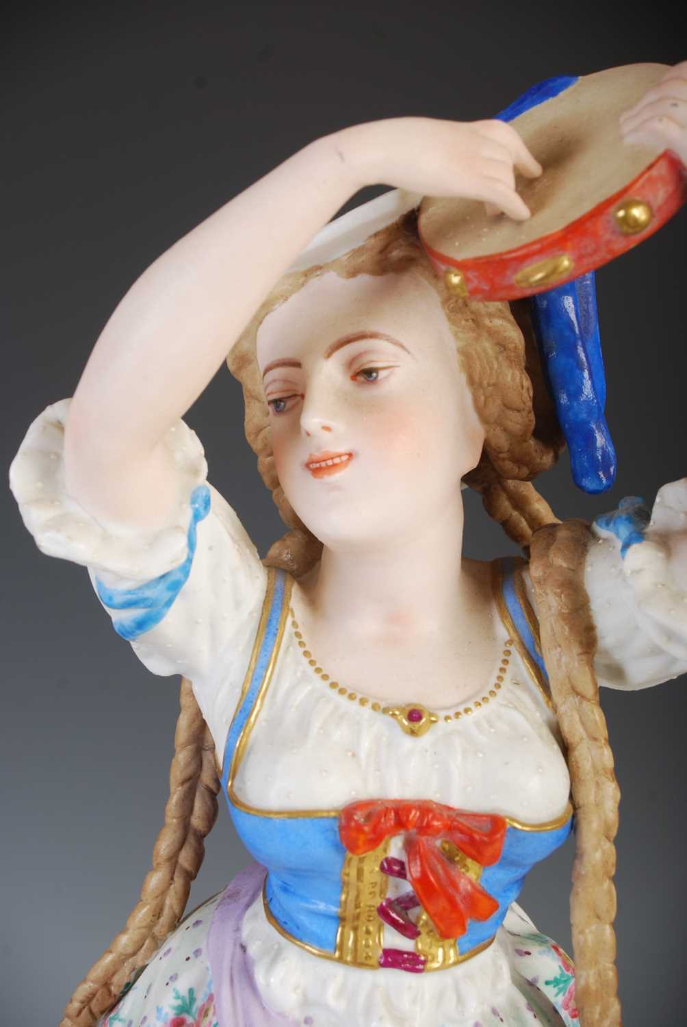 A pair of late 19th century French Bisque porcelain figures, modelled as a boy playing the - Image 2 of 9