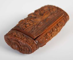 A coquilla nut oblong snuff box richly carved with military figures in a boat with a castle