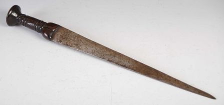 A 17th / 18th century Scottish dirk, the single edged blade and carved wood handle decorated with