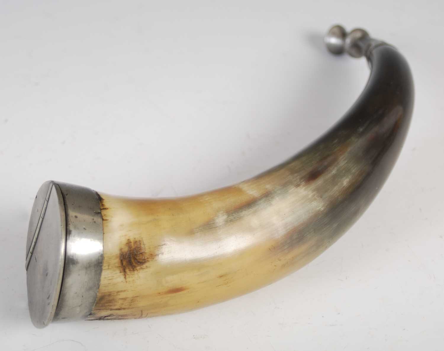 A large curved horn table snuff mull with pewter mounts and thistle terminal pierced with squares,