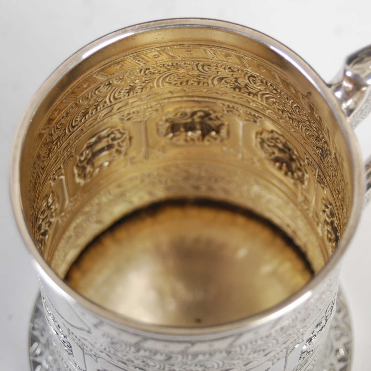 A Victorian Scottish silver christening mug, in the Indian taste, richly embossed with a band of - Image 4 of 6