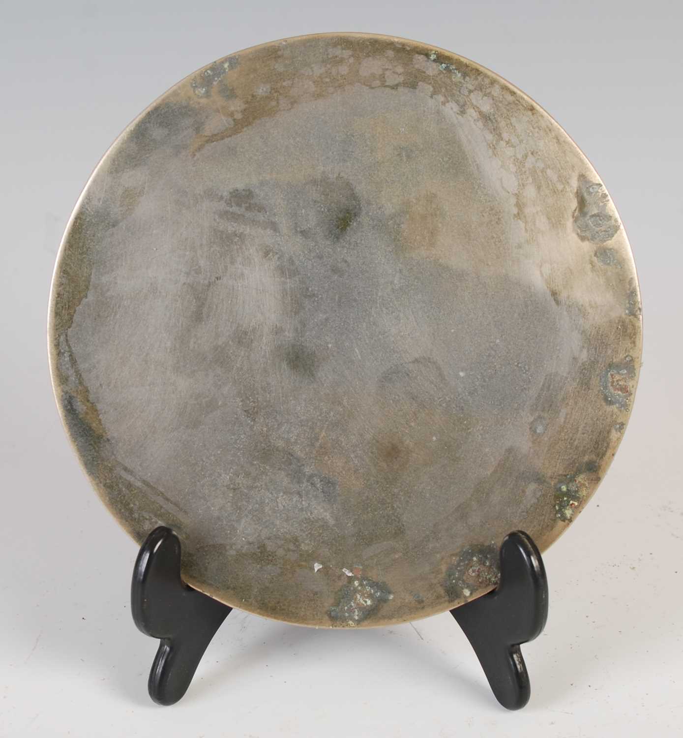 A Chinese bronze mirror, of circular form, cast with two borders of Archaic style motifs, 13cm - Image 2 of 2