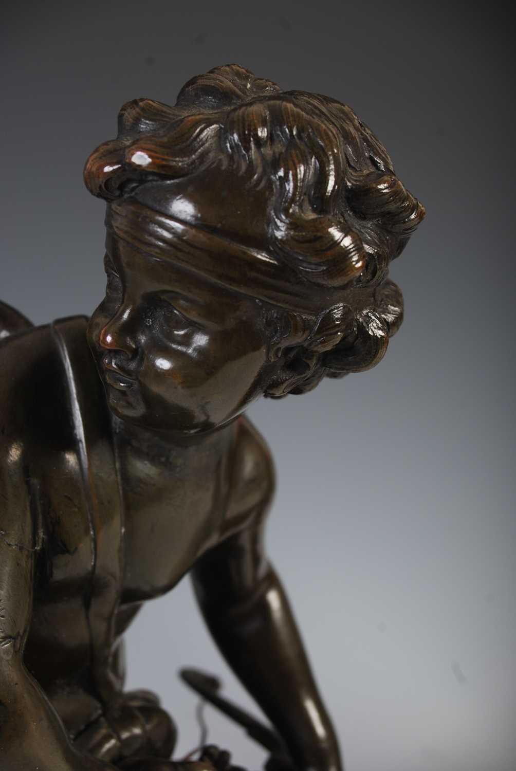 A pair of French bronze models of Cupid and a young girl, probably Psyche, in the manner of Louis- - Image 4 of 5