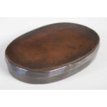 A large patinated copper oval tobacco box, the pull-off cover inscribed ‘R. Whinorey, KENDAL’,