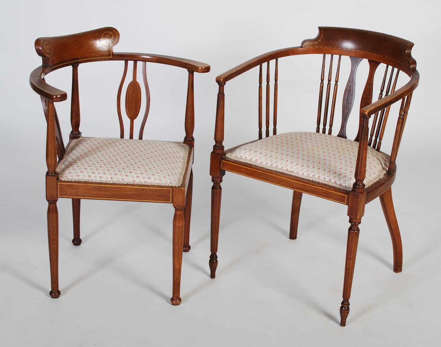 Two Edwardian mahogany chairs, one a horseshoe back armchair with vertical spindle gallery, floral