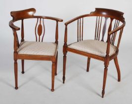 Two Edwardian mahogany chairs, one a horseshoe back armchair with vertical spindle gallery, floral