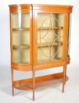 An Edwardian satinwood display cabinet, the moulded cornice above a single astragal glazed