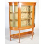 An Edwardian satinwood display cabinet, the moulded cornice above a single astragal glazed