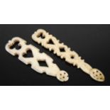 Two Scottish carved bone snuff spoons each formed as a miniature ‘love’ spoon, pierced with heart