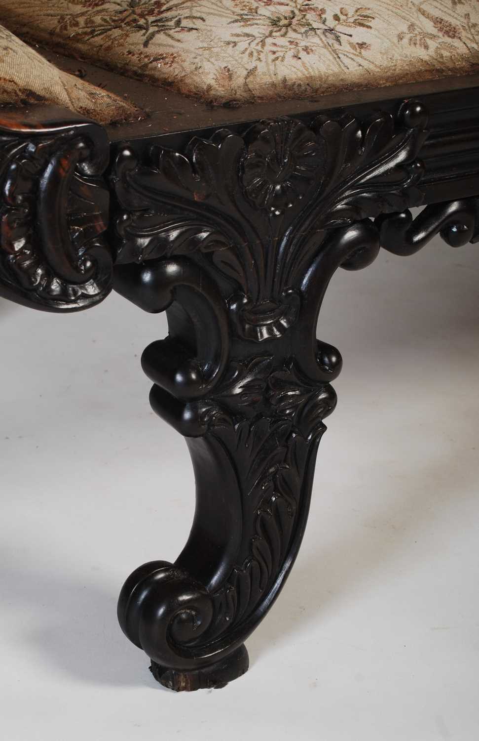 A 19th century Anglo-Indian coromandel sofa, the upright back centred with a shell carved motif - Image 4 of 7