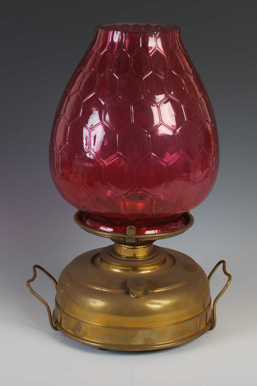 A late 19th century brass oil burning paraffin lamp, with ruby glass shade, 42.5cm high. - Image 4 of 5