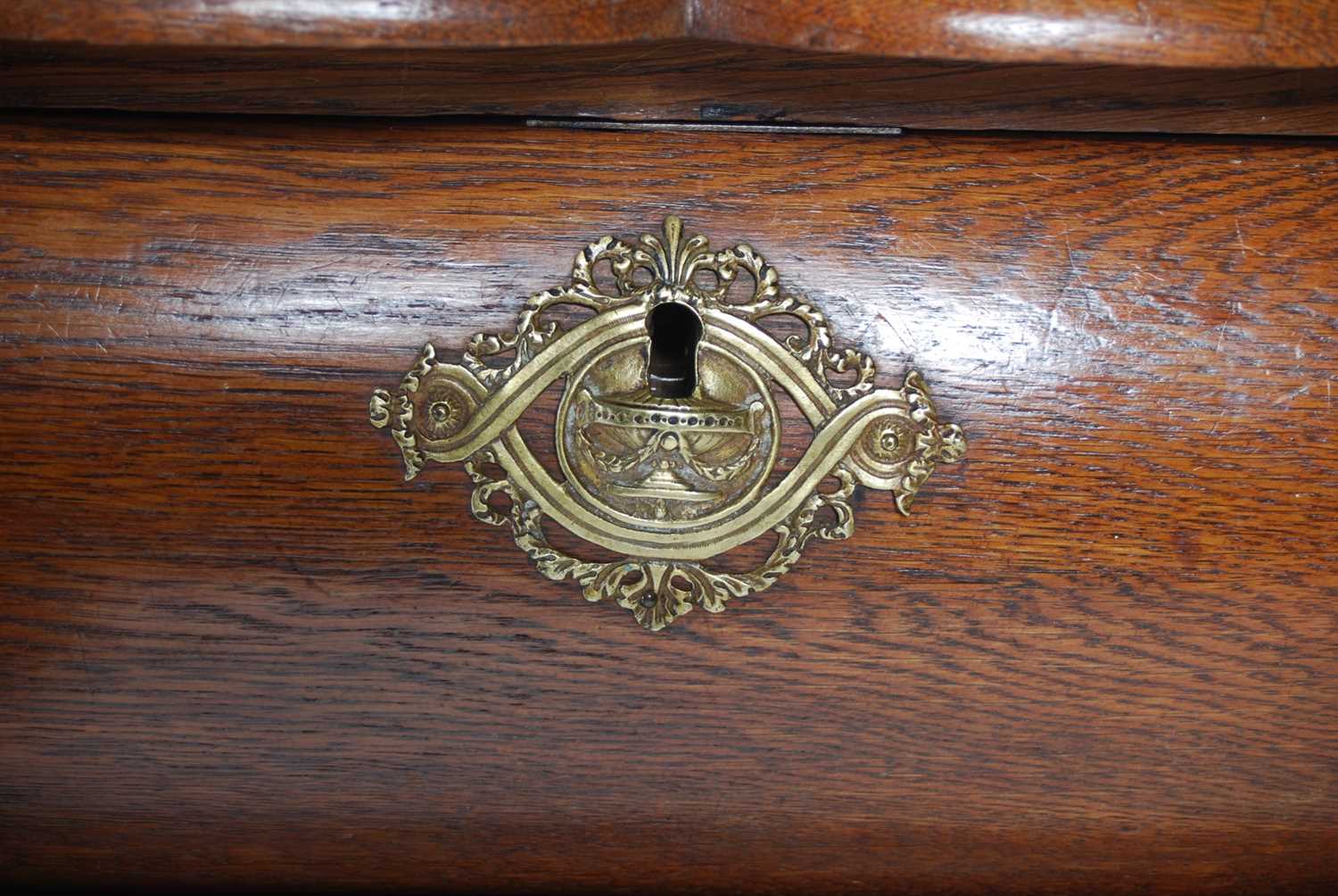 A late 18th century Dutch oak bombe chest, the shaped rectangular top above three long drawers and a - Image 6 of 9