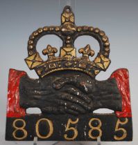 A cast iron plaque for Hand in Hand Insurance (1696-1905) policy 80585, with red and gilt painted