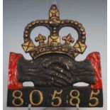 A cast iron plaque for Hand in Hand Insurance (1696-1905) policy 80585, with red and gilt painted