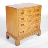 A reproduction walnut George III style bachelors chest, the rectangular top with moulded edge