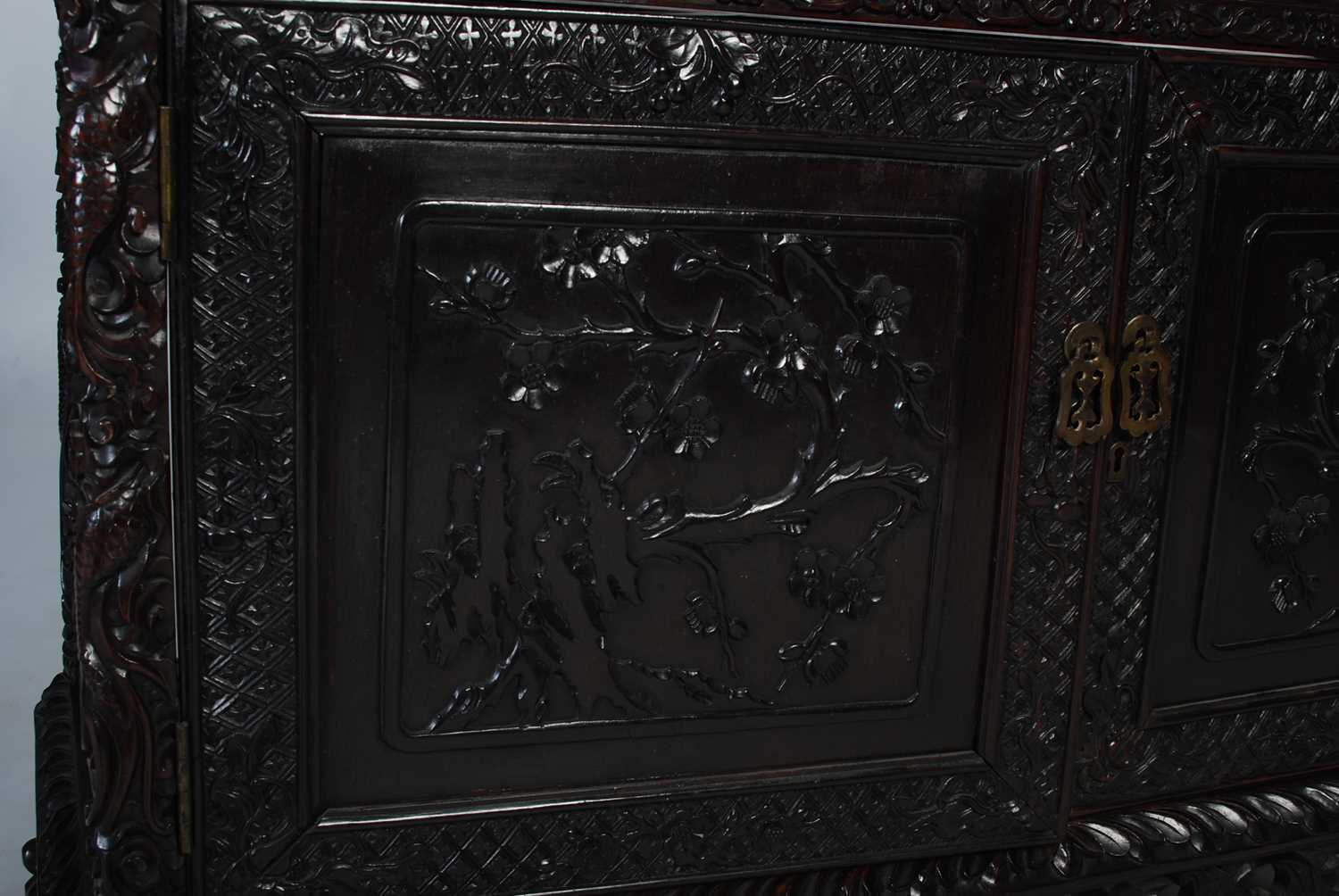 A late 19th century Chinese dark wood open display cabinet, with carved and pierced surmount of - Image 6 of 8