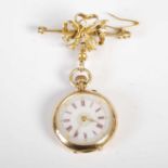 A late 19th / early 20th century yellow metal fob watch, the white, red and black Roman numeral dial