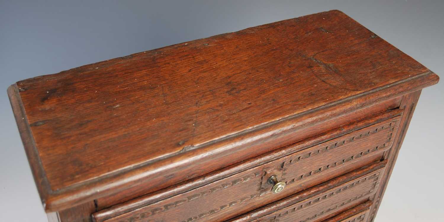 A late 18th / early 19th century French oak apprentice-made commode, the rectangular top with - Image 2 of 6