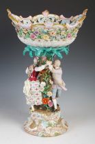 A Meissen porcelain table centrepiece, modelled with a pierced oval bowl supported on a tree form