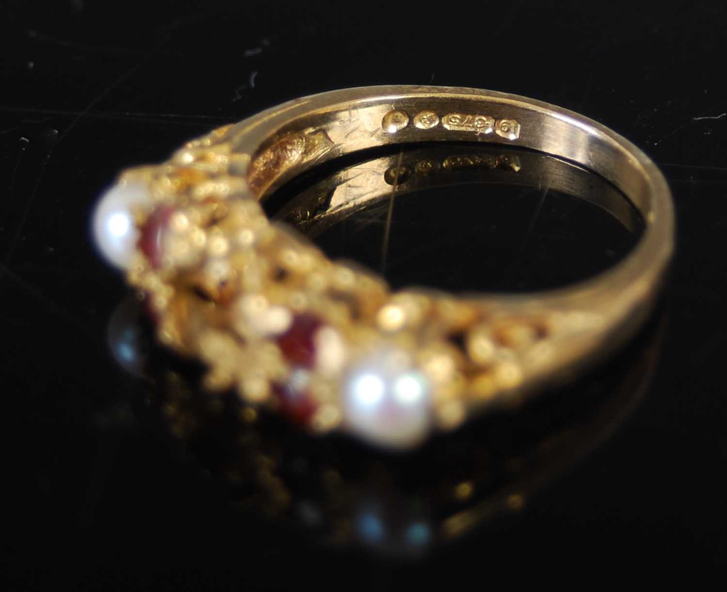 A group of three rings, to include a 9ct gold dress ring, size 'N' and two other 9ct gold and gem - Image 4 of 5