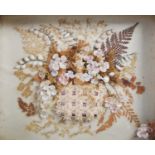A Victorian dried flower and shell montage, depicting a basket issuing flowers formed from shells
