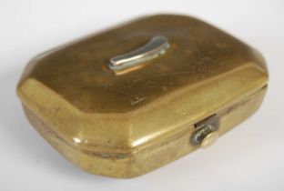 A brass cut-cornered oblong snuff box, the hinged cover engraving with a wine ewer, goblet and