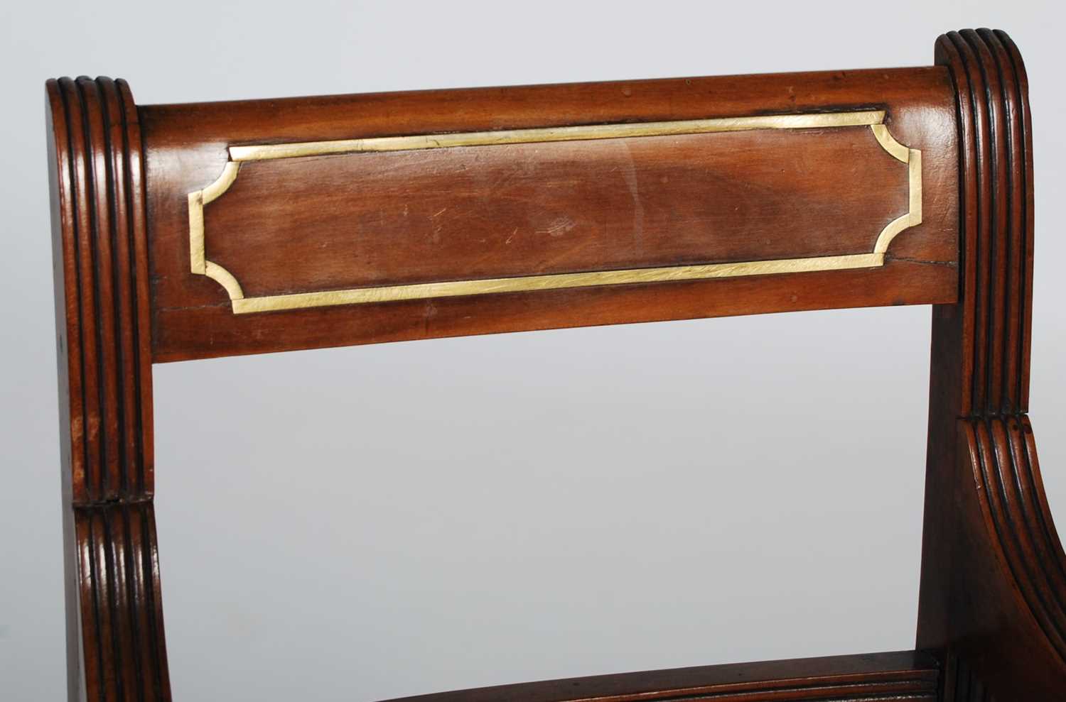 An early 19th century walnut and brass inlaid childs elbow chair, the rectangular top rail with - Image 2 of 6