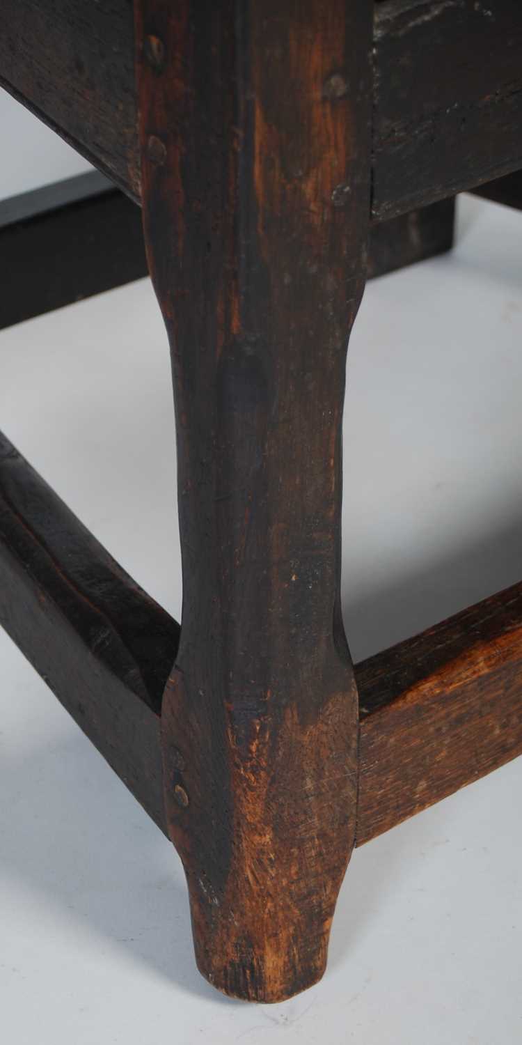An 18th century oak wainscot elbow chair, the shaped top rail carved with two demi-lune stylised - Image 4 of 7