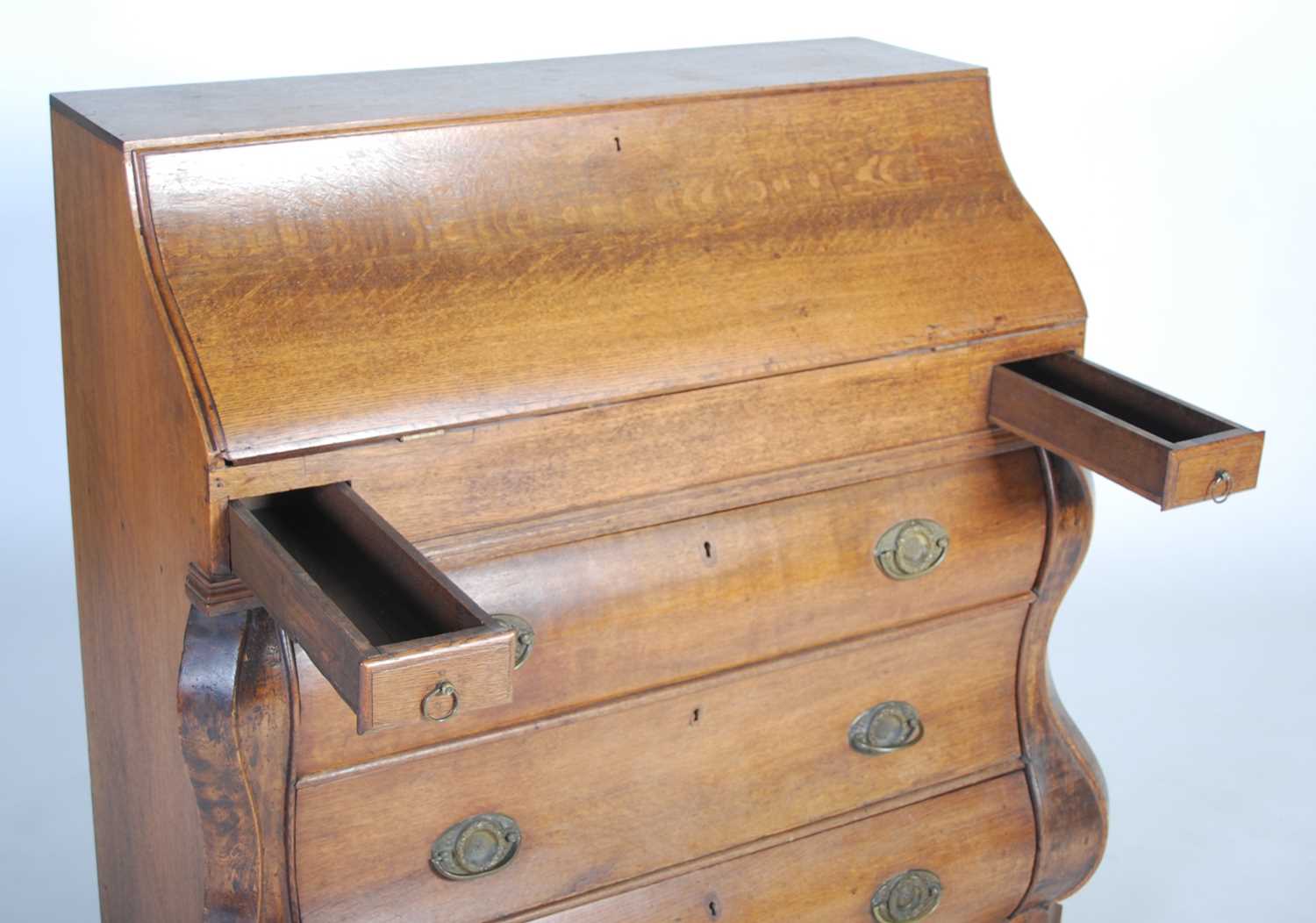 A late 18th century Dutch oak bombe bureau, the serpentine fall-front opening to a fitted interior - Image 8 of 11