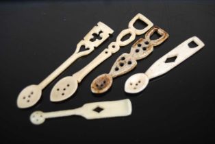 A group of five Scottish bone snuff spoons of various shapes and sizes, one with pierced shaped stem