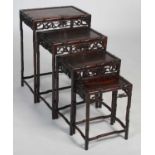 A Chinese dark wood quartetto of occasional tables, late 19th/ early 20th century, each of