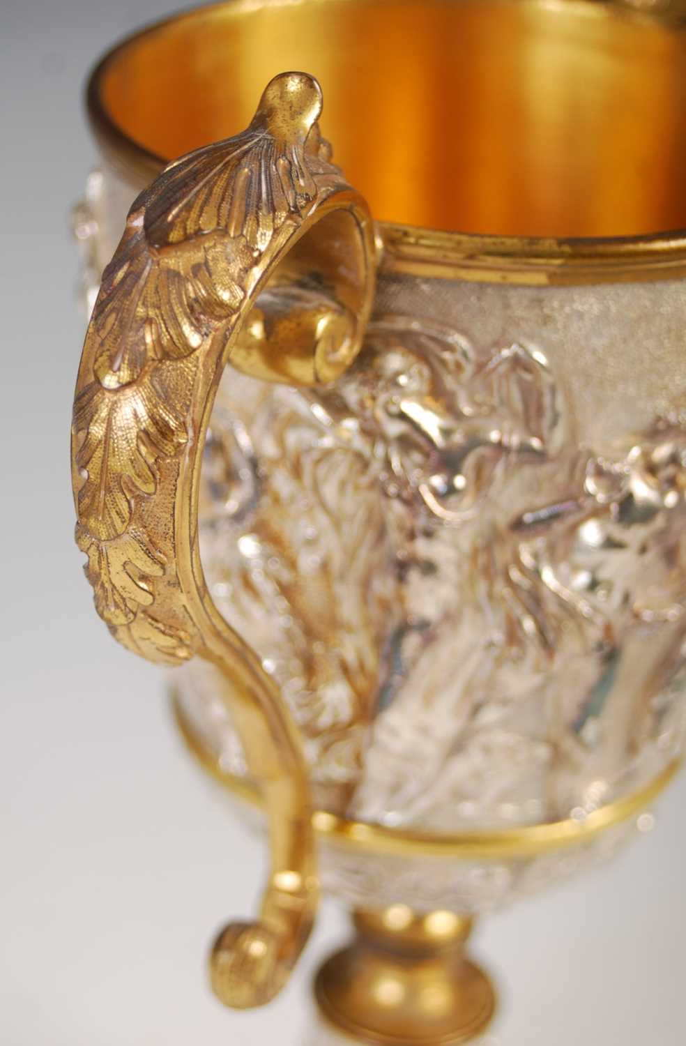 A Victorian silver-plated and gilt metal twin-handled cup, decorated in high relief with a frieze of - Image 4 of 7