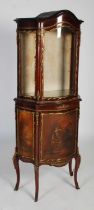 A late 19th century French mahogany and gilt metal mounted display cabinet, the moulded cornice