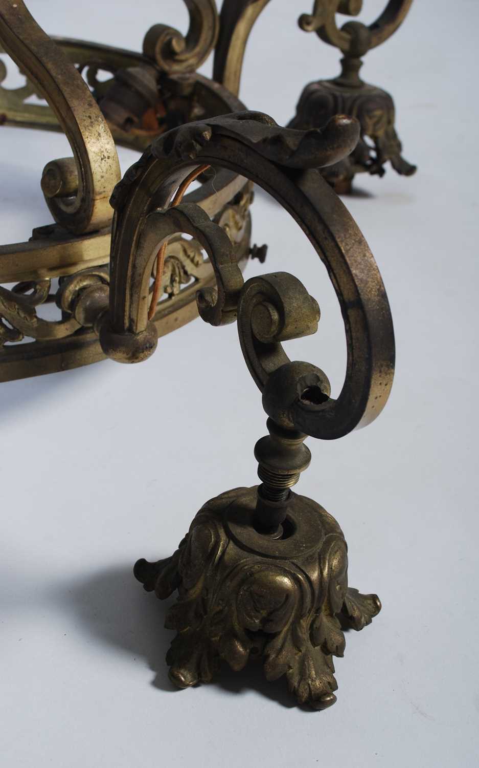 A late 19th/ early 20th century brass four-light hanging chandelier, set with four foliate cast - Image 4 of 6