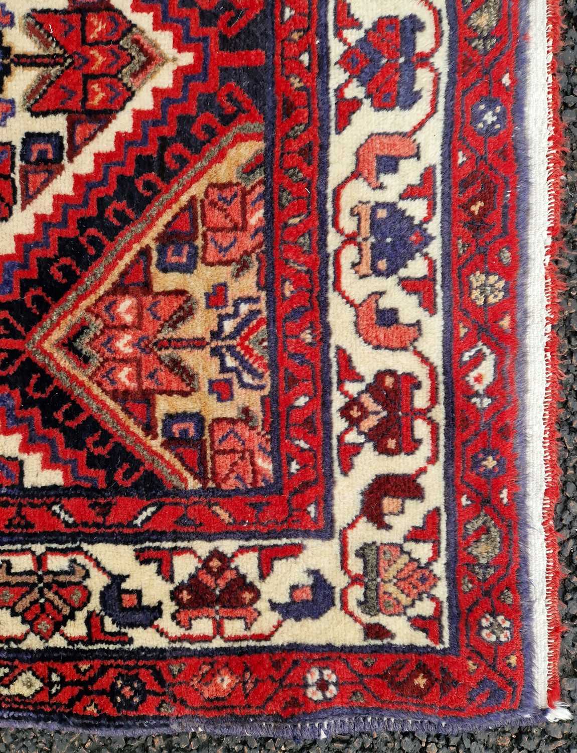 A north-west Persian long rug, 20th century, the rectangular field centred with a row of six lozenge - Image 3 of 5