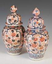 A pair of Japanese Imari porcelain jars and covers, late 19th / early 20th century, decorated with