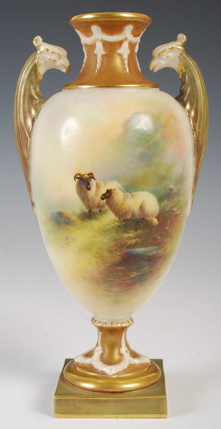 A Royal Worcester twin-handled urn, dated 1912, with hand-painted of two sheep grazing in a mossy