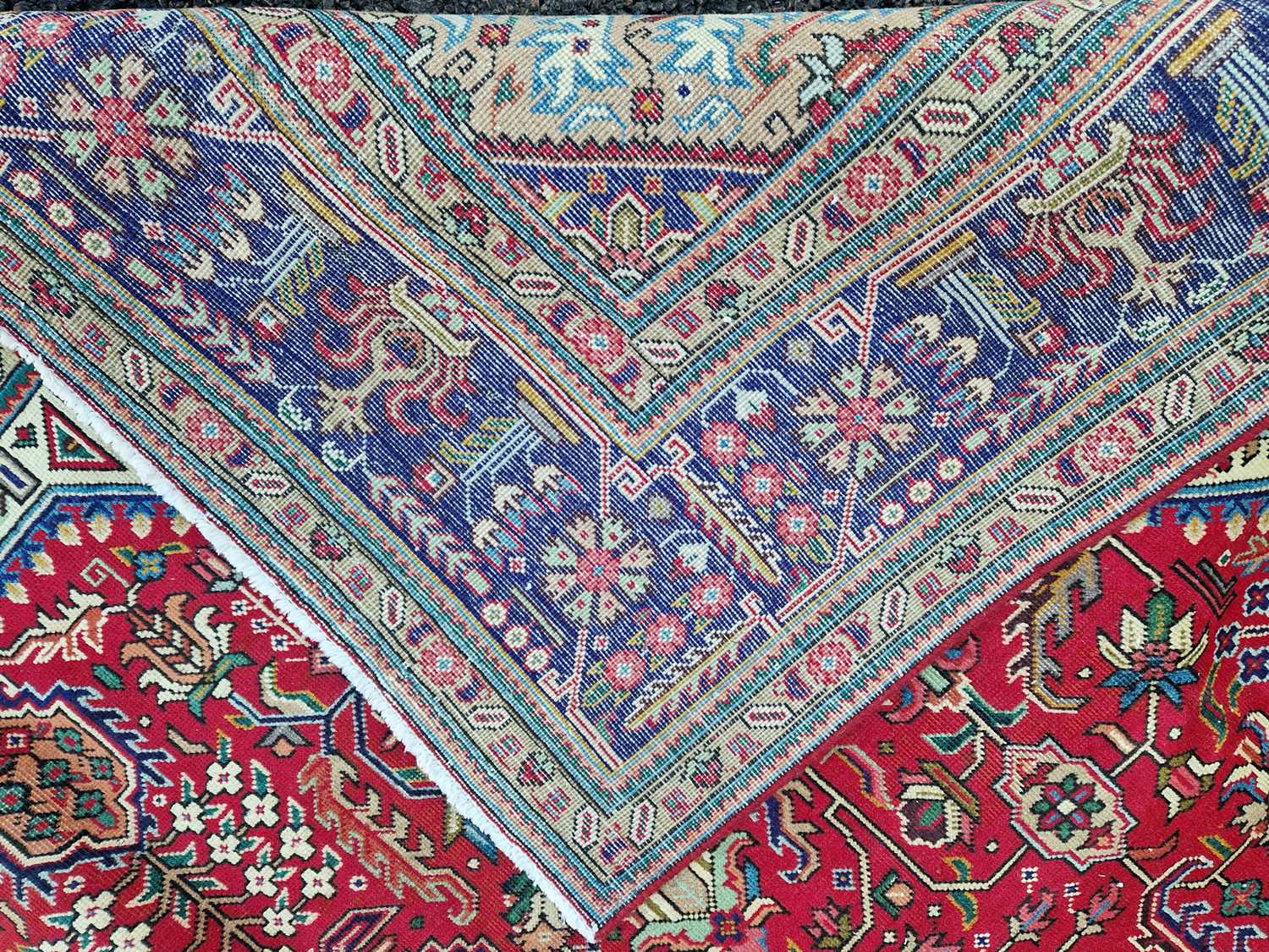 A Persian Tabriz carpet, 20th century, the rectangular madder field centred with a blue ground - Image 4 of 6